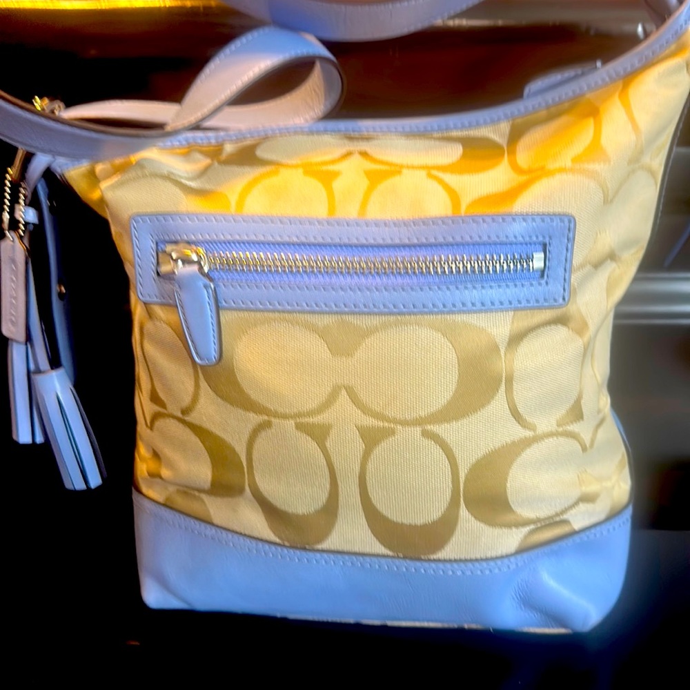 Vintage coach bucket style bag with thick leather strap.